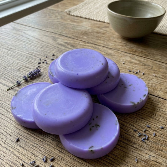 Elixoria Herbs lavender handmade soap in a floral shape, displayed in a premium botanical setting with lavender flowers for a nature-inspired skincare routine.